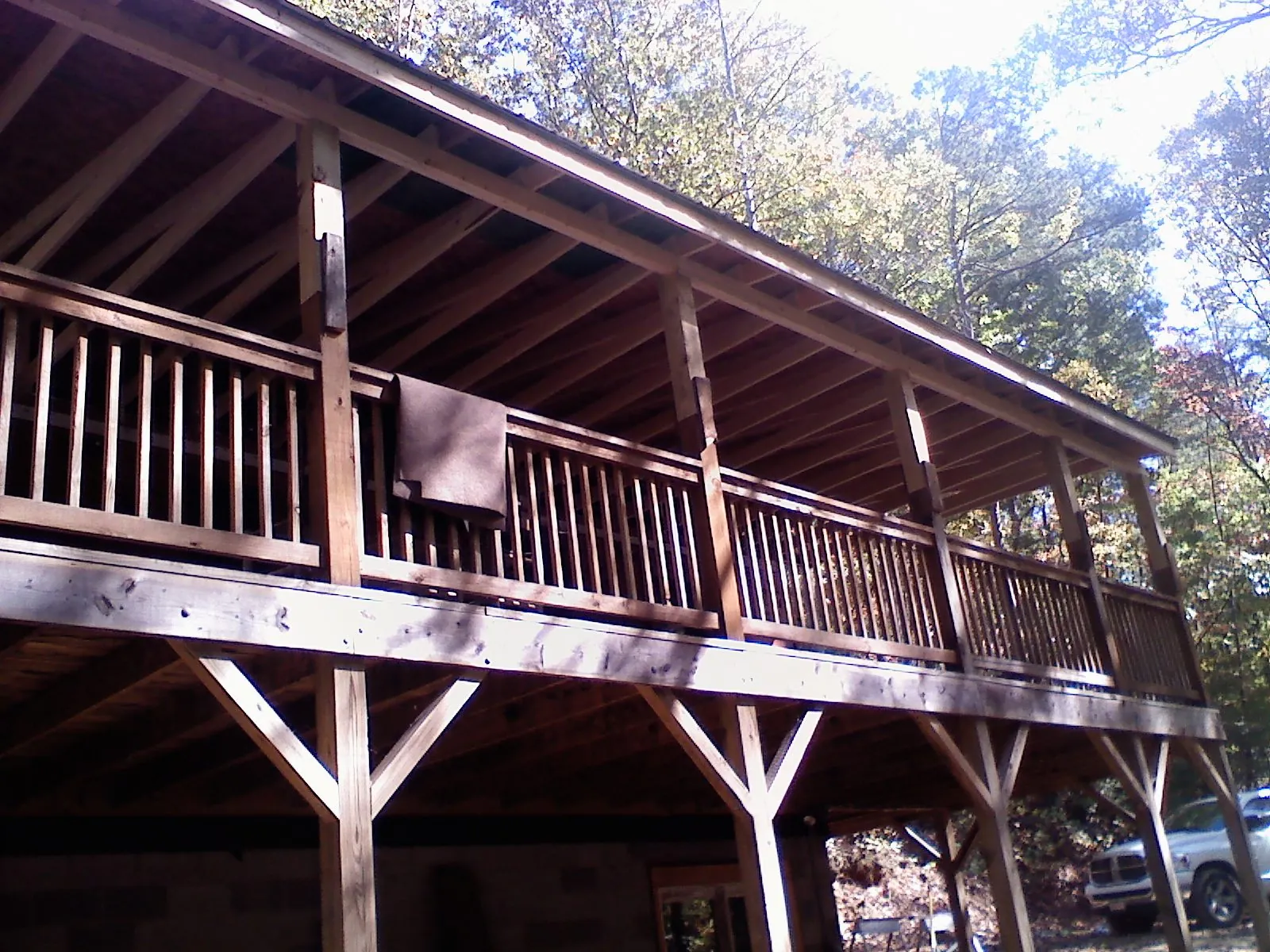 Timber framing under a new elevated porch and deck — Roof Leak Repair in Stowell by Roofing Brothers